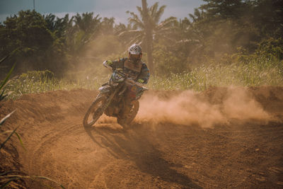 Horse riding motorcycle on land