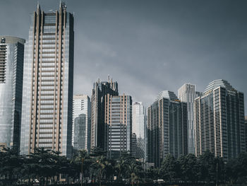 Modern buildings against sky in city