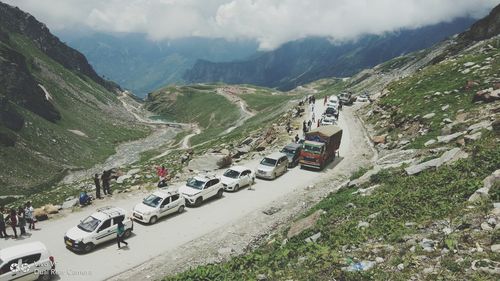 High angle view of cars on mountain road against sky