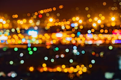 Defocused image of illuminated lights at night