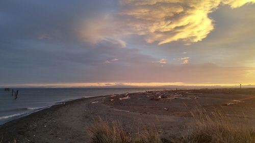 Scenic view of sea against cloudy sky