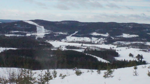 Scenic view of mountains against sky during winter