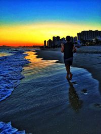 People on beach at sunset