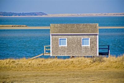 House on beach by sea at chatham, cape cod