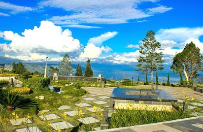 Scenic view of landscape against blue sky