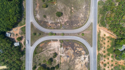 High angle view of highway amidst trees in city