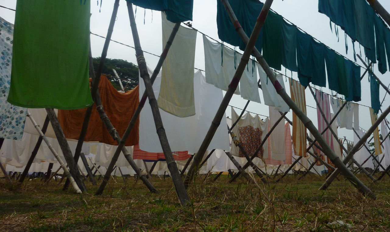 CLOTHES DRYING ON CLOTHESLINE AGAINST SKY