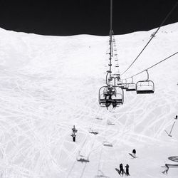 Ski lift over snowcapped mountain