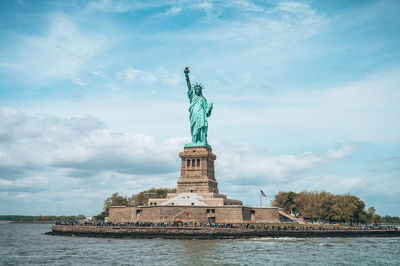 Low angle view of statue against sky