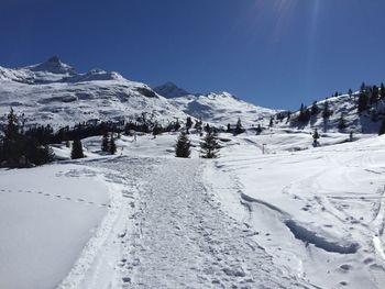 Scenic view of snow covered mountains