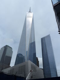 Low angle view of one world trade center against sky