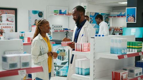 Female doctor examining chemical in clinic