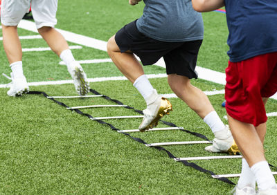Low section of people playing on grassland