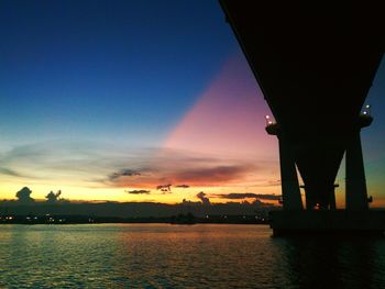 Silhouette of city at sunset