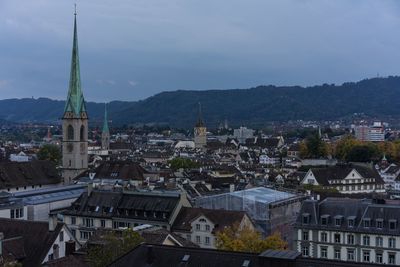 High angle view of buildings in town against sky