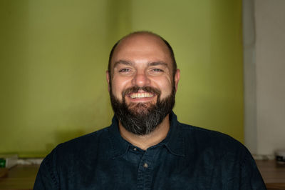 Portrait of man smiling at home