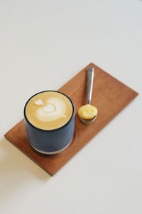 High angle view of coffee cup on table