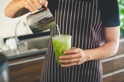 Midsection of man preparing food