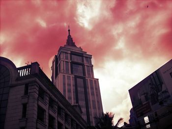 Low angle view of building against cloudy sky