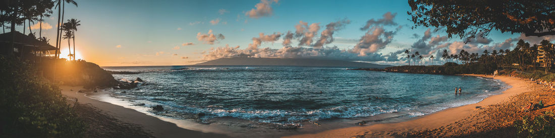 Panoramic view of sea against sky during sunset