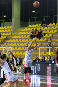 Group of people playing basketball court