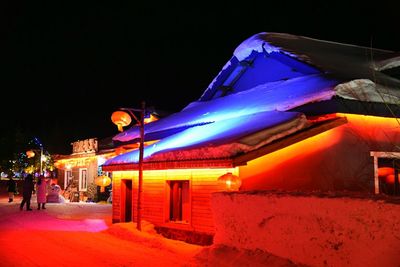 Illuminated building at night during winter