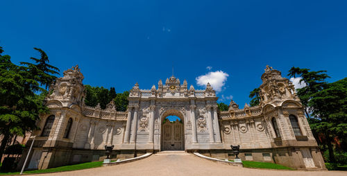 Low angle view of historical building against blue sky