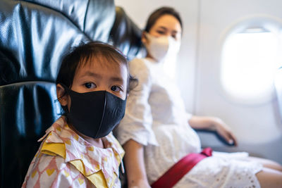 Portrait of cute girl in airplane 