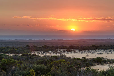 Scenic view of landscape against sky during sunset