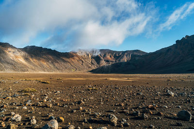 Scenic view of landscape and mountains against sky