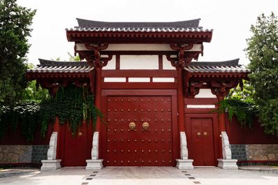 Entrance of temple against building