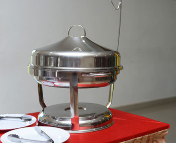 Close-up of drink on table against wall