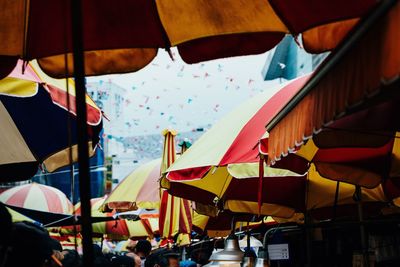 Low angle view of parasols at fish market