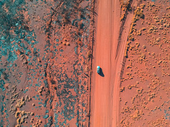 High angle view of metal door on sand