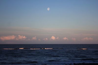 Scenic view of sea against sky at sunset