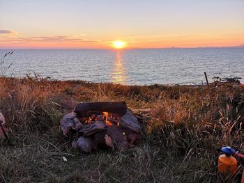 Scenic view of sea against sky during sunset