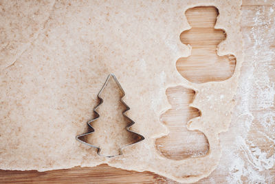 High angle view of dough on wooden table