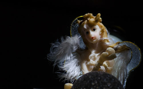 Close-up of stuffed toy against black background