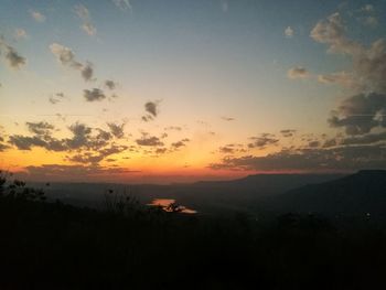 Scenic view of silhouette mountain against sky during sunset