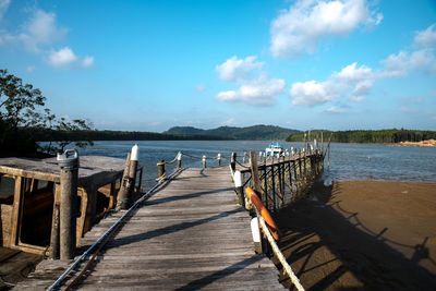 Pier over sea against sky