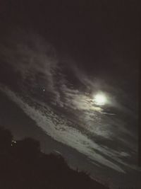 Low angle view of moon in sky at night