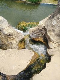 High angle view of rocks by river