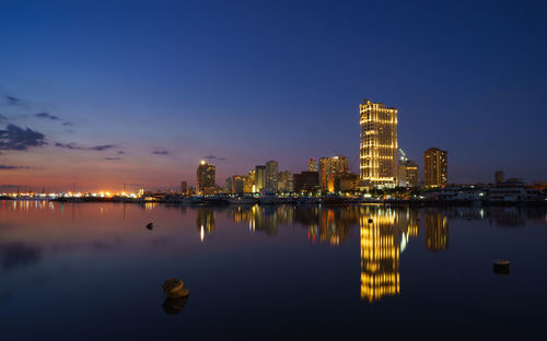 Reflection of buildings in city at night
