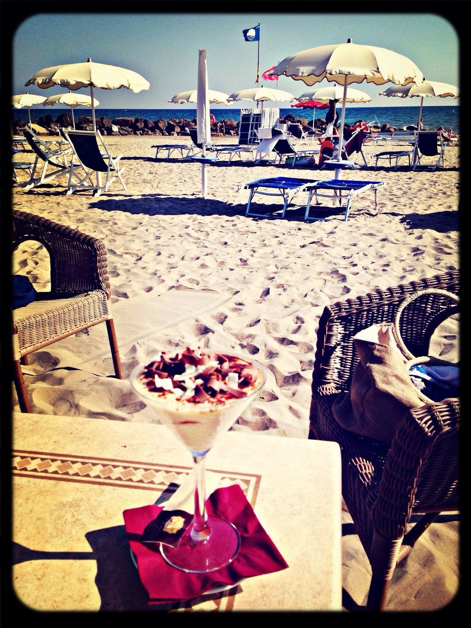 beach, sea, sand, shore, chair, water, beach umbrella, horizon over water, relaxation, lounge chair, vacations, table, parasol, sunlight, deck chair, summer, absence, sunshade, day, person