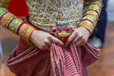 Midsection of woman wearing mask