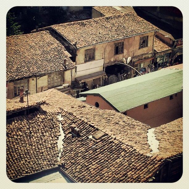 transfer print, building exterior, architecture, auto post production filter, built structure, high angle view, house, cobblestone, street, roof, residential structure, residential building, city, outdoors, day, sunlight, no people, building, shadow, footpath