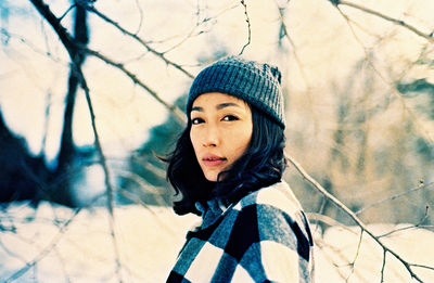 Close-up portrait of young woman in winter