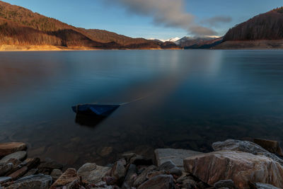 Scenic view of calm lake against sky