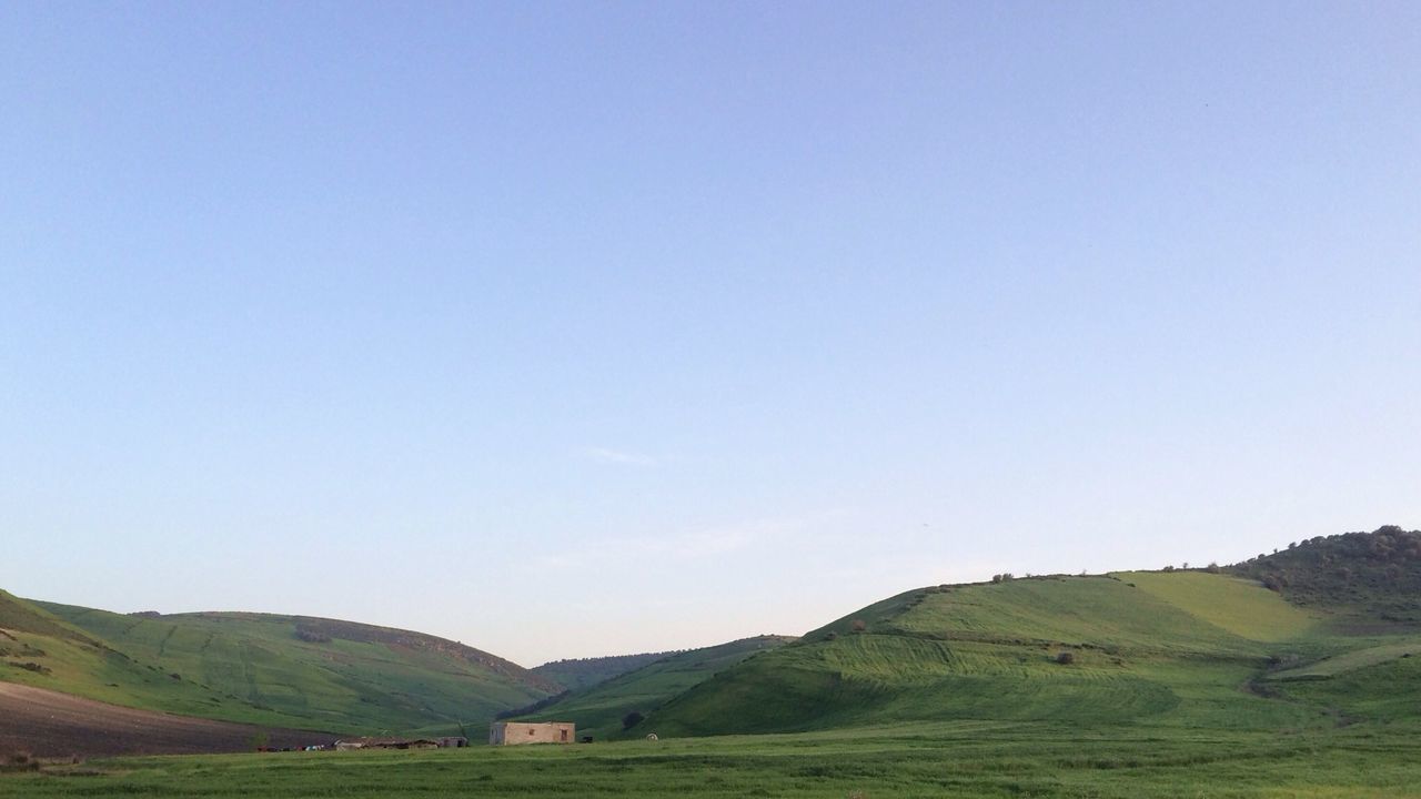 landscape, mountain, clear sky, copy space, grass, tranquility, tranquil scene, scenics, field, beauty in nature, nature, mountain range, blue, non-urban scene, hill, grassy, countryside, remote, sky, idyllic