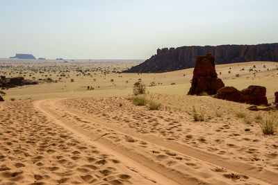 Scenic view of desert against clear sky